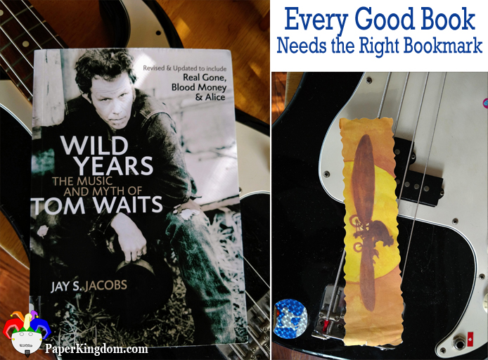 Wild Years: the Music and Myth of Tom Waits by J. S. Jacobs marked with a library bookmark of a man peddling a winged bicycle